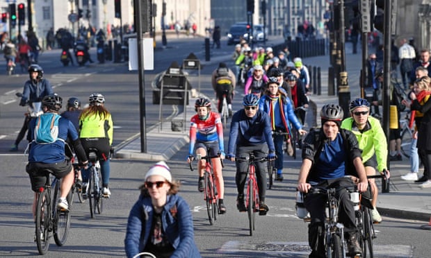 Many people riding bikes in London