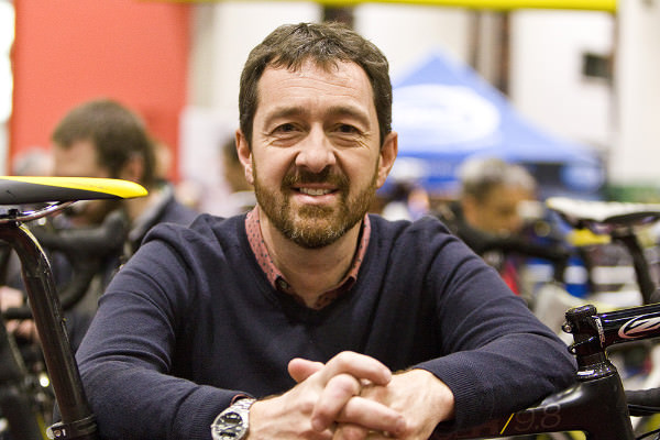 Chris Boardman with cycling equipment
